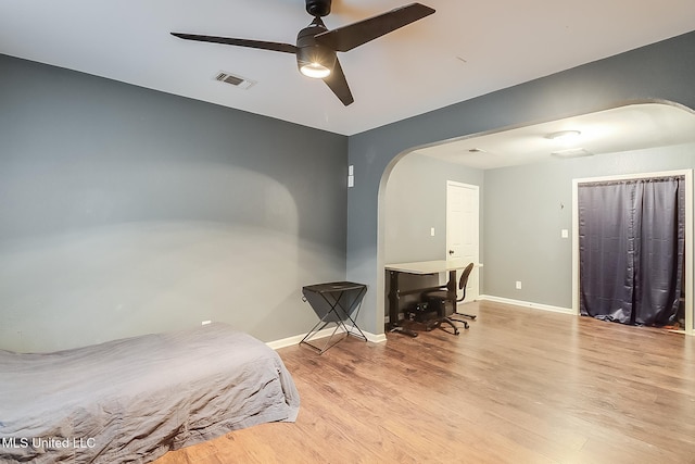 bedroom with ceiling fan and light hardwood / wood-style flooring