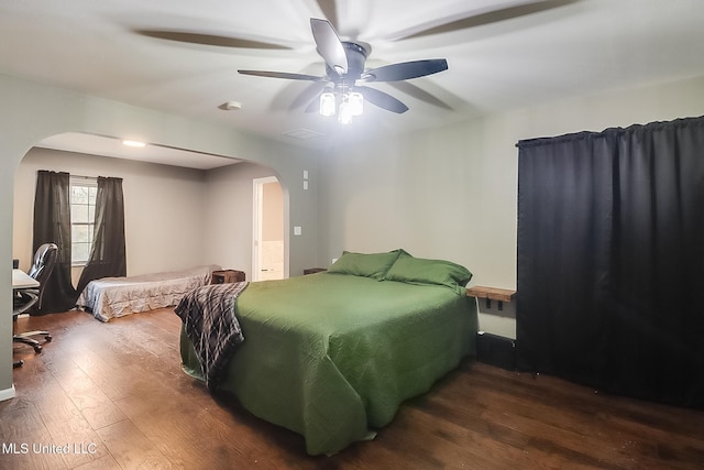 bedroom featuring dark wood-type flooring and ceiling fan