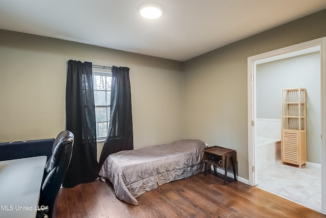 bedroom featuring hardwood / wood-style flooring