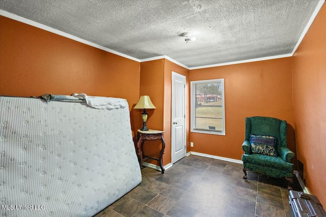 sitting room with a textured ceiling and crown molding