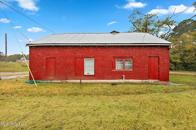 view of property exterior featuring a lawn