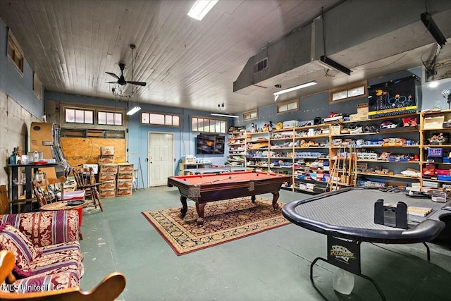 playroom with ceiling fan, concrete floors, and pool table