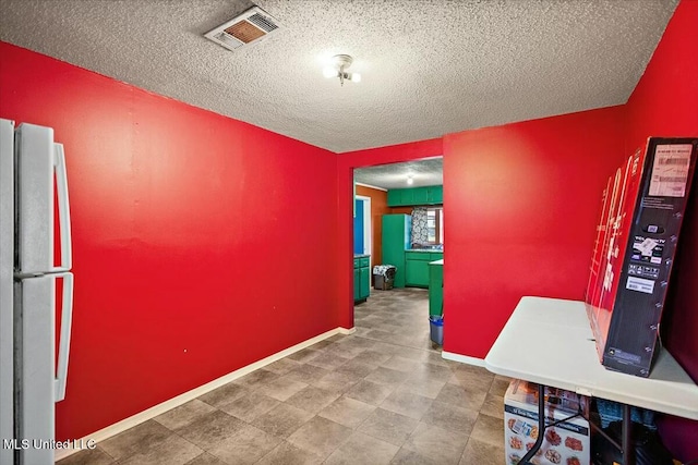 interior space featuring a textured ceiling