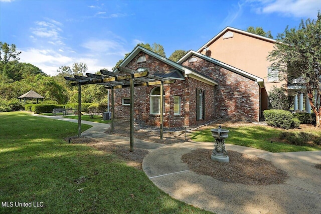 607 Tiffintown Rd, Vicksburg, MS 39183 - view of front of house with brick siding, central AC unit, a pergola, and a front yard