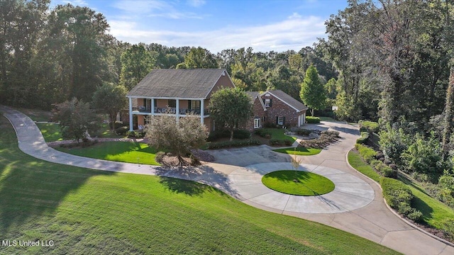 607 Tiffintown Rd, Vicksburg, MS 39183 - exterior space featuring a forest view, a lawn, and curved driveway