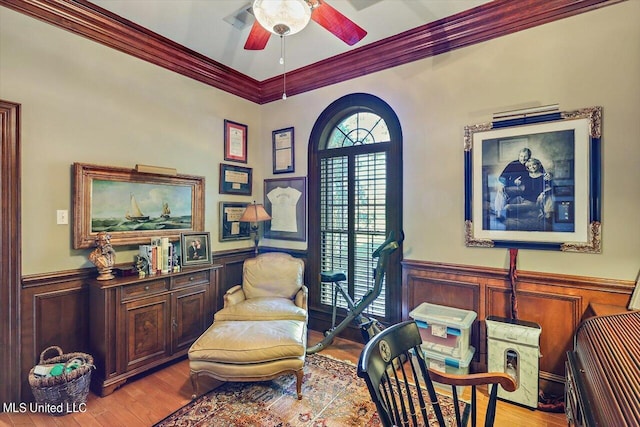 607 Tiffintown Rd, Vicksburg, MS 39183 - sitting room featuring wainscoting, a ceiling fan, ornamental molding, and wood finished floors