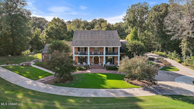 607 Tiffintown Rd, Vicksburg, MS 39183 - neoclassical / greek revival house featuring stucco siding, a front lawn, a porch, and a balcony