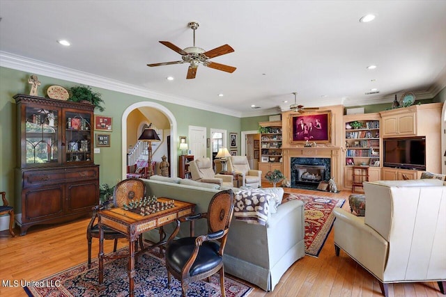 607 Tiffintown Rd, Vicksburg, MS 39183 - living room featuring light wood-type flooring, a ceiling fan, recessed lighting, and a fireplace