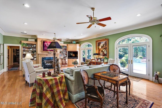 607 Tiffintown Rd, Vicksburg, MS 39183 - living area featuring french doors, recessed lighting, a ceiling fan, crown molding, and a high end fireplace