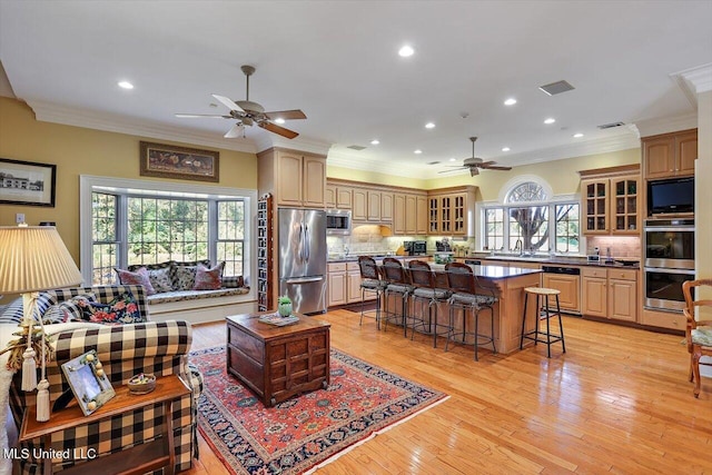 607 Tiffintown Rd, Vicksburg, MS 39183 - living area with ornamental molding, a ceiling fan, and light wood-type flooring