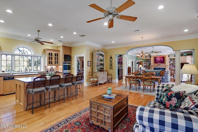 607 Tiffintown Rd, Vicksburg, MS 39183 - living area with recessed lighting, ornate columns, ornamental molding, and ceiling fan with notable chandelier
