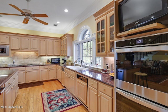 607 Tiffintown Rd, Vicksburg, MS 39183 - kitchen with a ceiling fan, a sink, glass insert cabinets, stainless steel appliances, and ornamental molding