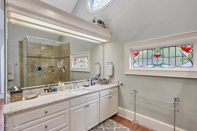 607 Tiffintown Rd, Vicksburg, MS 39183 - bathroom featuring baseboards, wood finished floors, vanity, and a stall shower