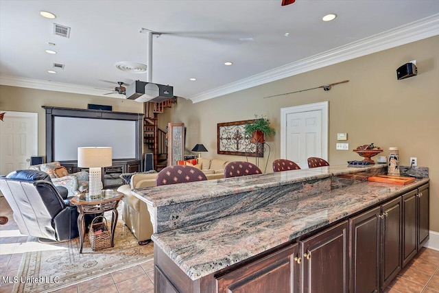 607 Tiffintown Rd, Vicksburg, MS 39183 - interior space featuring visible vents, a ceiling fan, light tile patterned floors, light stone countertops, and crown molding
