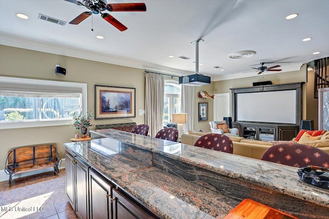 607 Tiffintown Rd, Vicksburg, MS 39183 - kitchen featuring a healthy amount of sunlight, open floor plan, ceiling fan, and visible vents