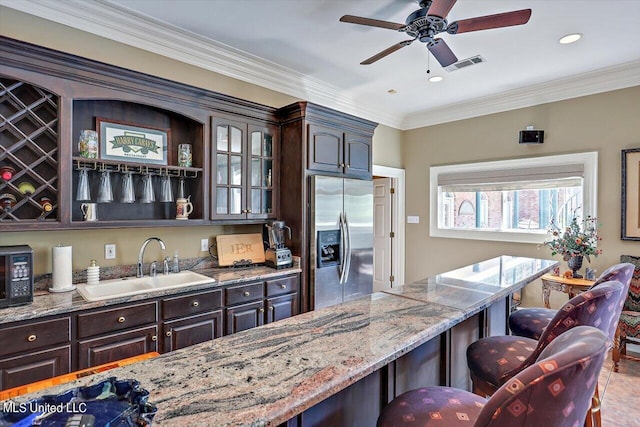 607 Tiffintown Rd, Vicksburg, MS 39183 - bar featuring visible vents, a ceiling fan, a sink, black microwave, and stainless steel refrigerator with ice dispenser