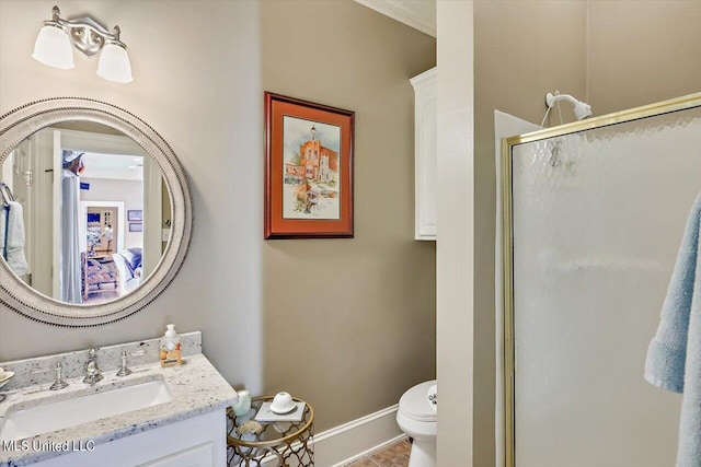 607 Tiffintown Rd, Vicksburg, MS 39183 - bathroom with toilet, baseboards, vanity, and a stall shower