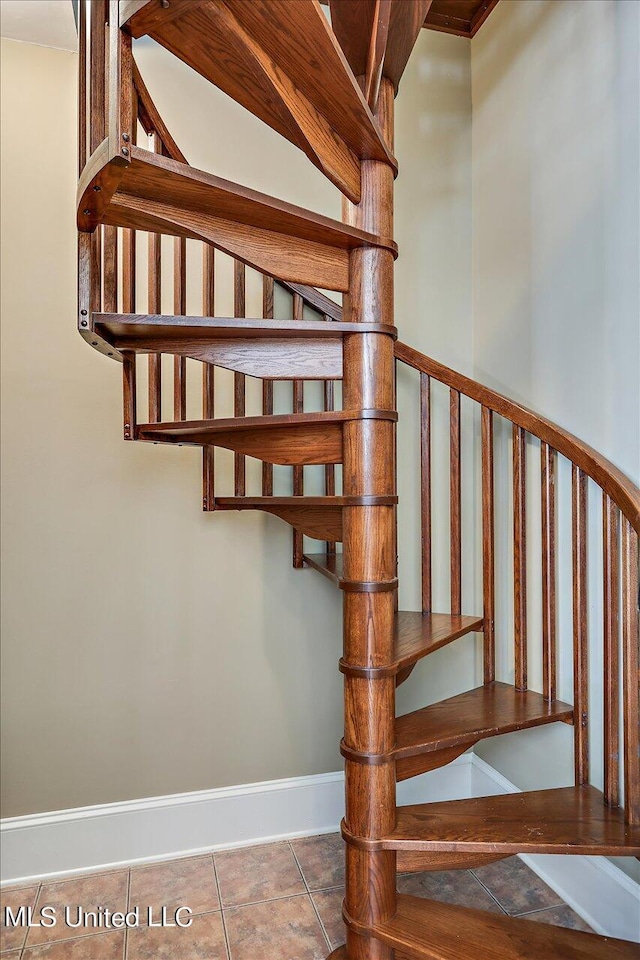 607 Tiffintown Rd, Vicksburg, MS 39183 - staircase featuring tile patterned flooring and baseboards