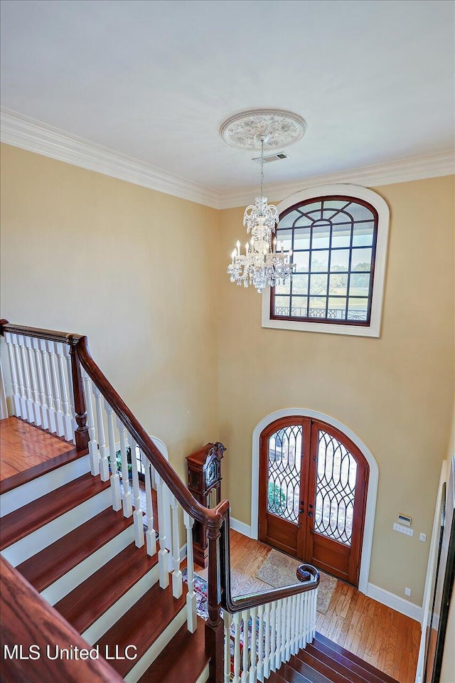 607 Tiffintown Rd, Vicksburg, MS 39183 - foyer entrance with a wealth of natural light, french doors, a chandelier, and stairs