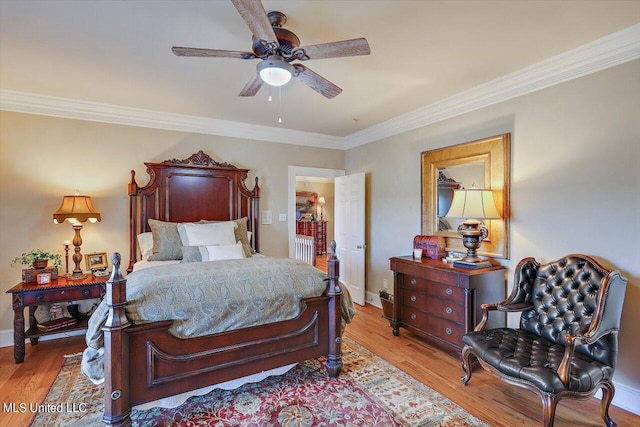 607 Tiffintown Rd, Vicksburg, MS 39183 - bedroom featuring baseboards, wood finished floors, ornamental molding, and ceiling fan