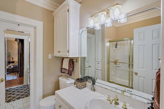 607 Tiffintown Rd, Vicksburg, MS 39183 - bathroom with toilet, vanity, a shower stall, and crown molding