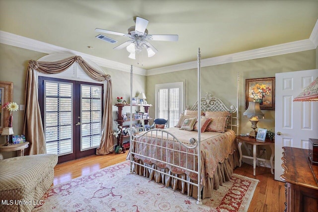 607 Tiffintown Rd, Vicksburg, MS 39183 - bedroom with wood finished floors, visible vents, access to exterior, french doors, and ceiling fan