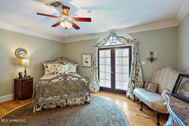 607 Tiffintown Rd, Vicksburg, MS 39183 - bedroom with wood finished floors, visible vents, ornamental molding, and access to outside