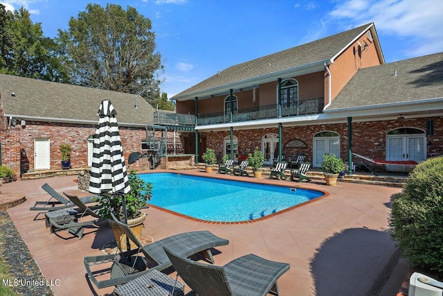 607 Tiffintown Rd, Vicksburg, MS 39183 - outdoor pool with french doors and a patio