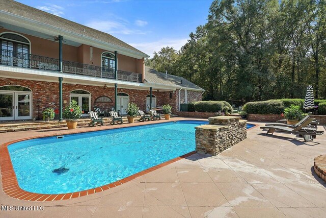 607 Tiffintown Rd, Vicksburg, MS 39183 - outdoor pool with a patio area and french doors