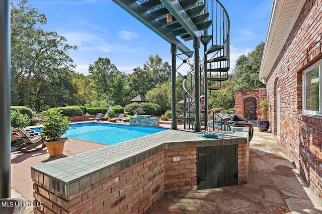 607 Tiffintown Rd, Vicksburg, MS 39183 - pool with exterior bar, a patio, stairs, and exterior kitchen