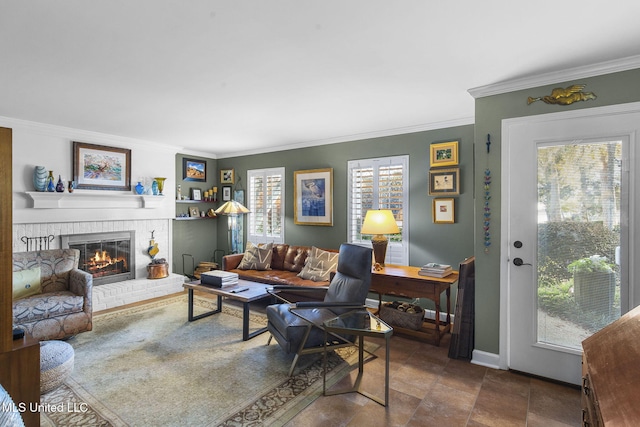 living room with a brick fireplace and crown molding