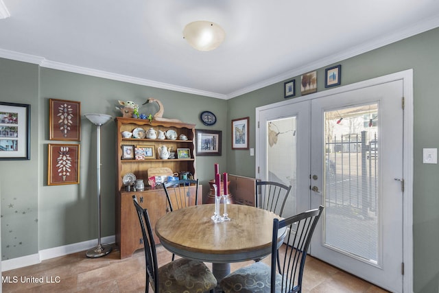 tiled dining area with french doors and ornamental molding