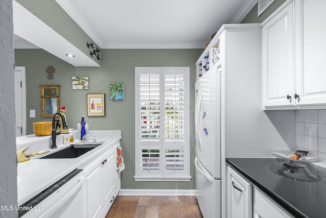 kitchen with white cabinetry, sink, white appliances, and ornamental molding