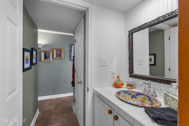 bathroom with tile patterned flooring and vanity