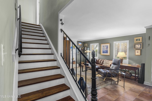 stairway featuring crown molding