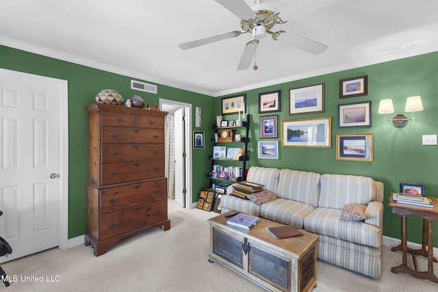 living room featuring light carpet, ceiling fan, and ornamental molding