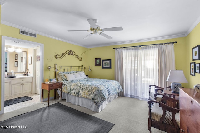 carpeted bedroom featuring ensuite bathroom, ceiling fan, and ornamental molding