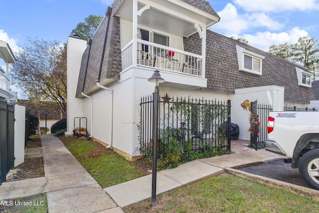 view of front of home with a balcony