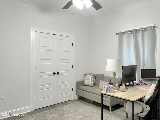 office area featuring crown molding, ceiling fan, and light wood-type flooring