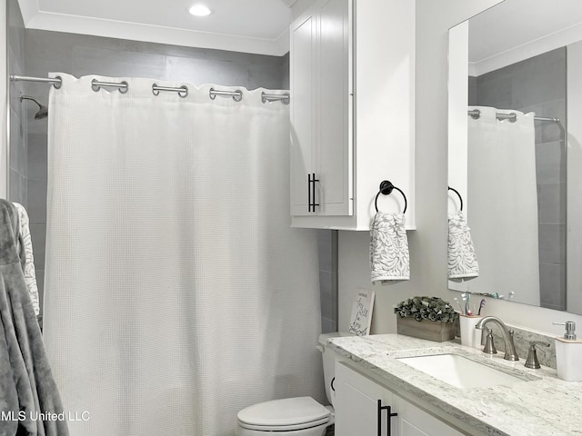 bathroom with vanity, curtained shower, and toilet