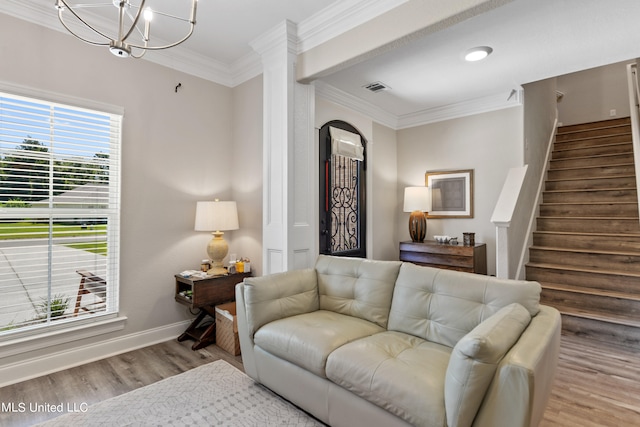 living room with light hardwood / wood-style floors and crown molding