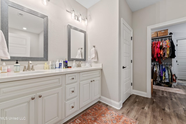 bathroom with vanity and hardwood / wood-style floors