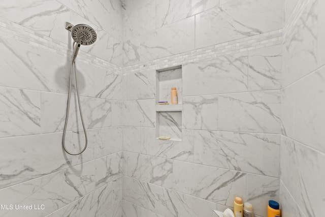 details featuring a tile shower