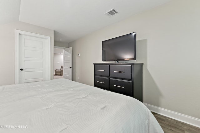 bedroom featuring dark wood-type flooring