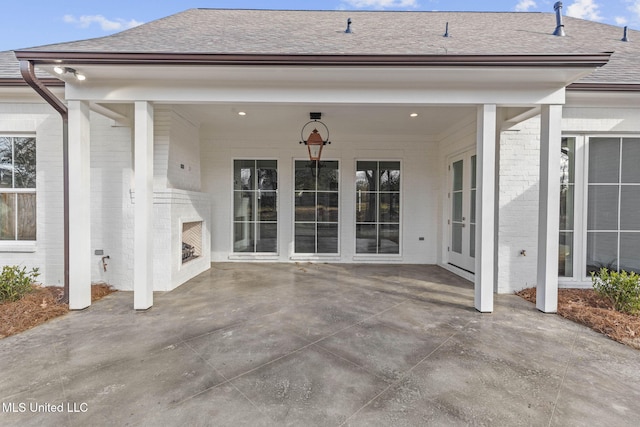 view of patio featuring exterior fireplace