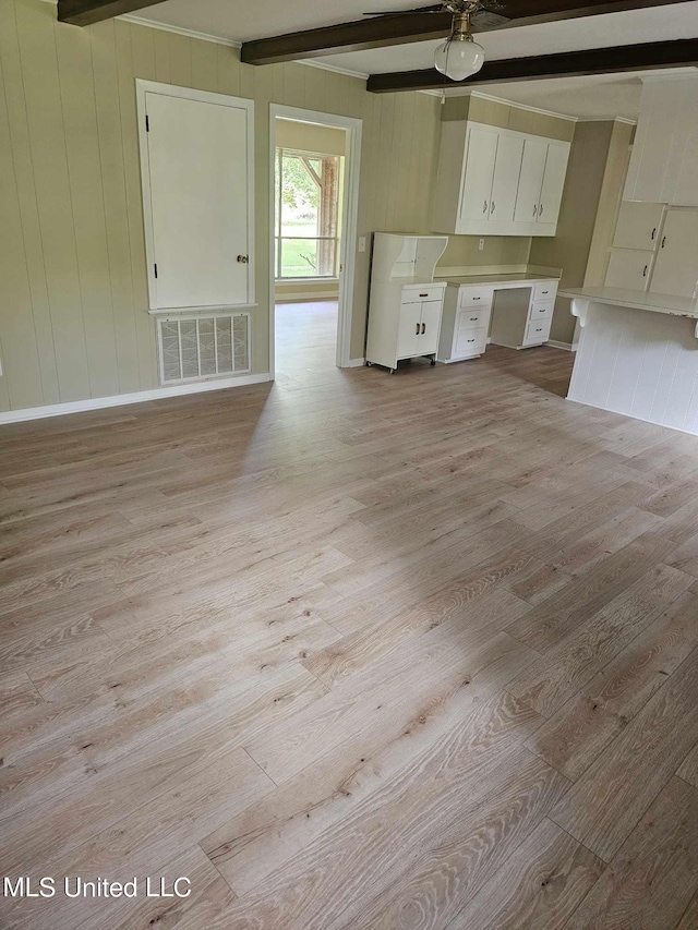 kitchen with white cabinetry, beam ceiling, light hardwood / wood-style floors, and ceiling fan