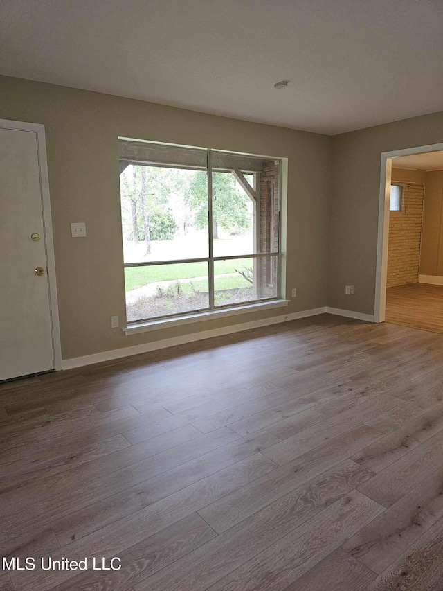 spare room featuring light hardwood / wood-style floors