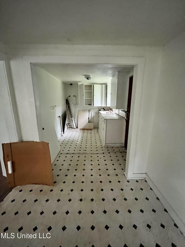 bathroom featuring tile patterned floors and baseboards