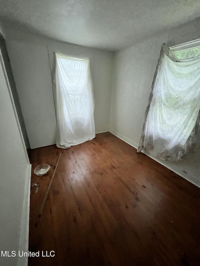 unfurnished bedroom featuring wood finished floors