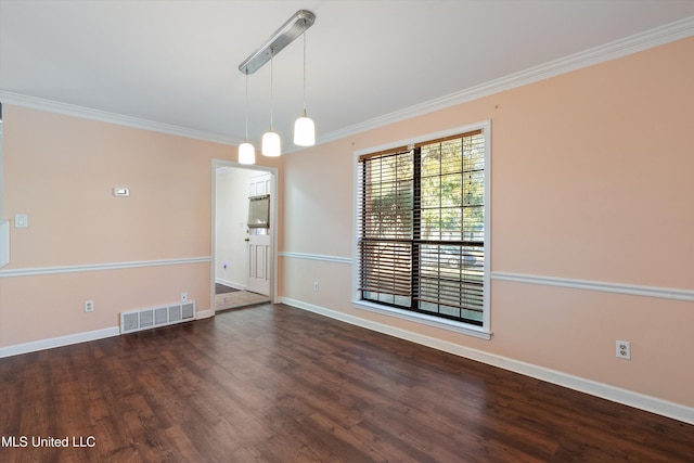 spare room featuring crown molding and dark wood-type flooring